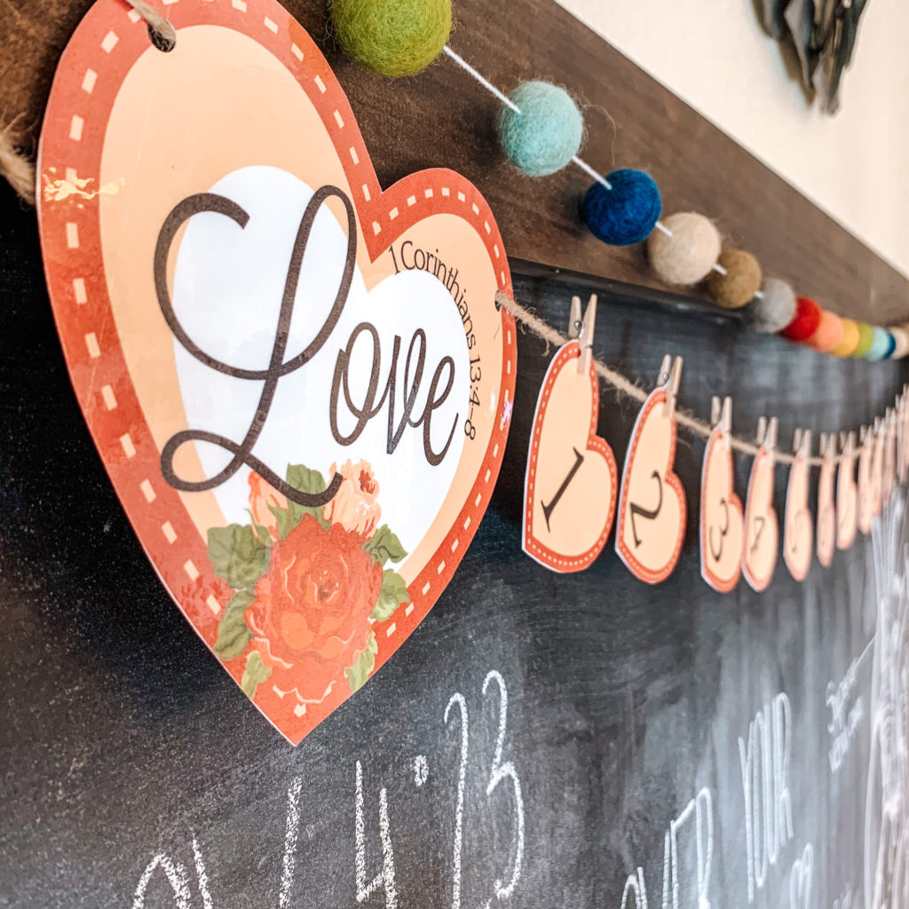 This year I'm using Valentine's Day to teach my kids about Christ's love with this cute Valentine's Day countdown banner! #ValentinesDay #Countdown #1Corinthians #loveispatient #christianhomeschool #kidsbibleactivity #bibleprintable
