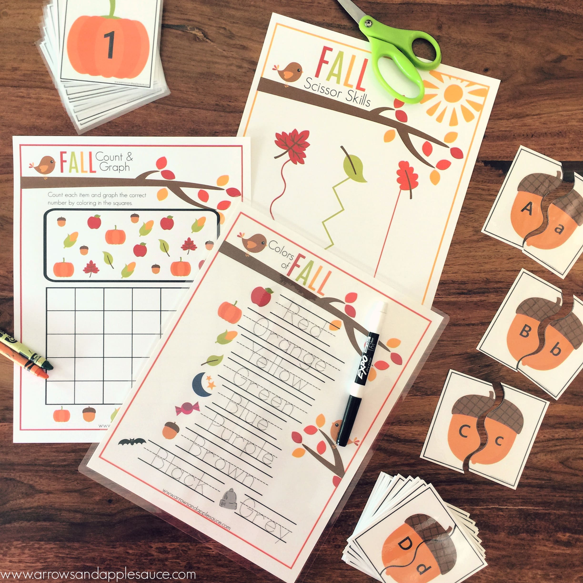 We're adding a little seasonal fun to our homeschool routine with this fun printable fall theme activity bundle. Your preschooler will love it! Practice alphabet matching, scissor skills and fine motor, counting and graphing, number sense, penmanship, and color recognition. #falltheme #preschooltheme #fallpreschoolactivities #fallkidsactivities #printablefallworksheets #homeschoolprintables #alphabetgames #scissorskills #preschoolmath #numbergames #pumpkingames
