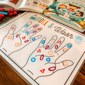 This new hand washing game uses dice as a fun way to practice counting (and shapes/colors if you want) along with a little hygiene lesson tucked in. #kidshygiene #teachhandwashing #preschoolmath #homeschoolscience #germslesson #kidsgermactivity #teachinghygiene #preschoolathome #freeprintables