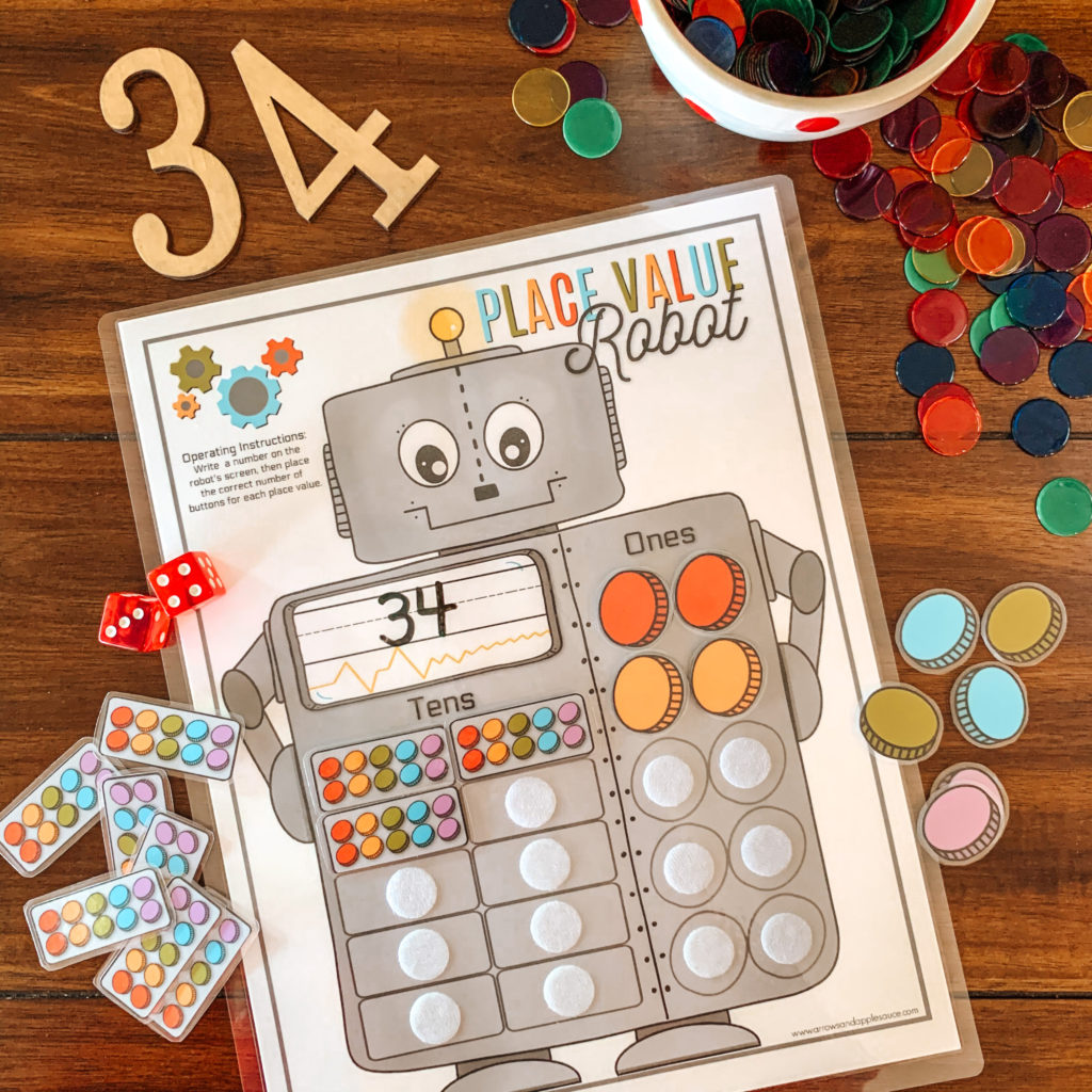Learning about place value was a big hurdle. This cute and easy to use printable place value robot made it easy to understand and fun! #placevalue #homeschoolmath #Kindergarten #kindergartenmath #robotactivity #homeeducation #mathgame