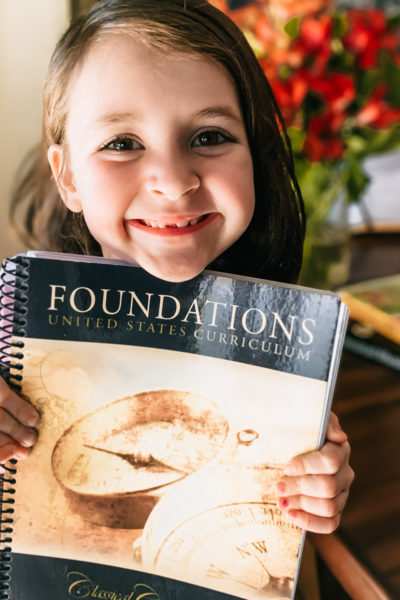 We're adding Classical Conversations to our homeschool routine and couldn't be more excited! Even though it's not going quite as expected. #classicalconversations #ccfoundations #homeschoolcurriculum #homeeducation #firstgradehomeschool #classicaleducation #learningathome