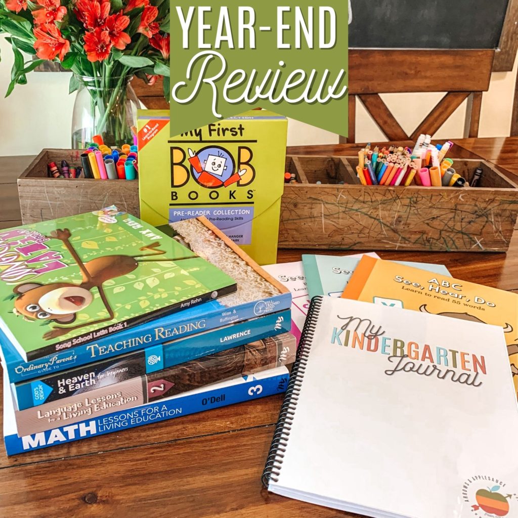 We're taking a look back for an honest year end review of our second grade and kindergarten curriculum picks! #curriculumreview #secondgrade #kindergarten #homeschoolcurriculum #masterbooksreview #songschoollatin #abcseeheardo #kindergartenjournal