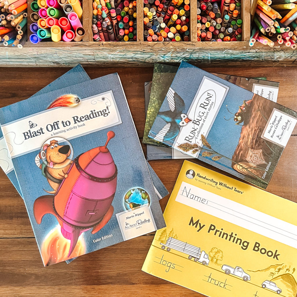 The boys are starting first grade and kindergarten this year! Take a look at the curriculum we'll be enjoying together! #firstgrade #homeschoolkindergarten #homeschoolcurriculum #firstgrademath #firstgradereading #kindergarten #busybinder
